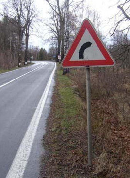 Right - left bend road sign