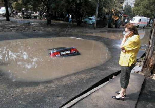 Car drowns in puddle