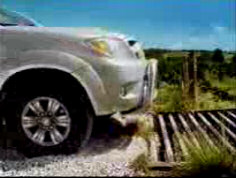 Cows drive Mitsubishi pickup stop at cattle grid