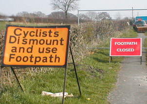 Cyclists dismount and use footpath - FOOTPATH CLOSED