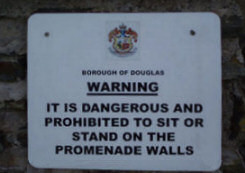 Warning - Dangerous to Sit on wall