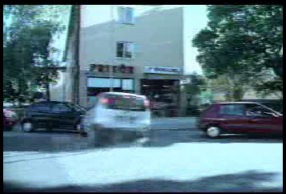 White car skids into parking space