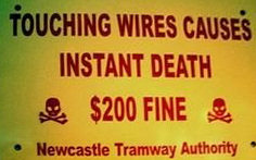 funny signs - Touching wires causes instant death