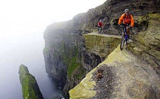 Bikers on mountain edge