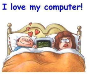 Man and woman in bed with computer cartoon