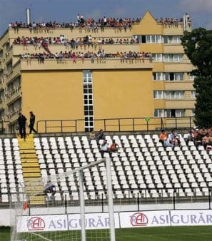 Fans on building watching match