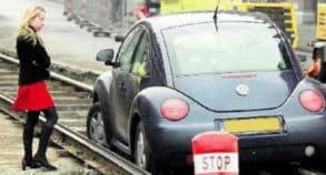car stuck on rail tracks