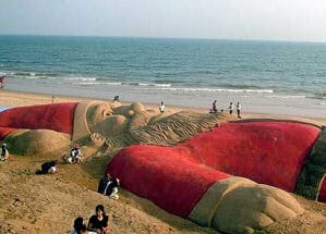 Santa lying on beach