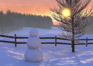 Christmas snowman at sunset
